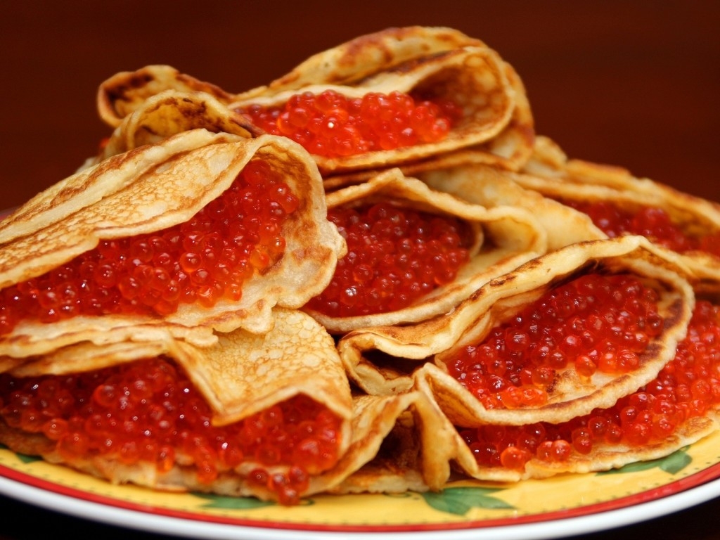 russian pancakes crossword clue